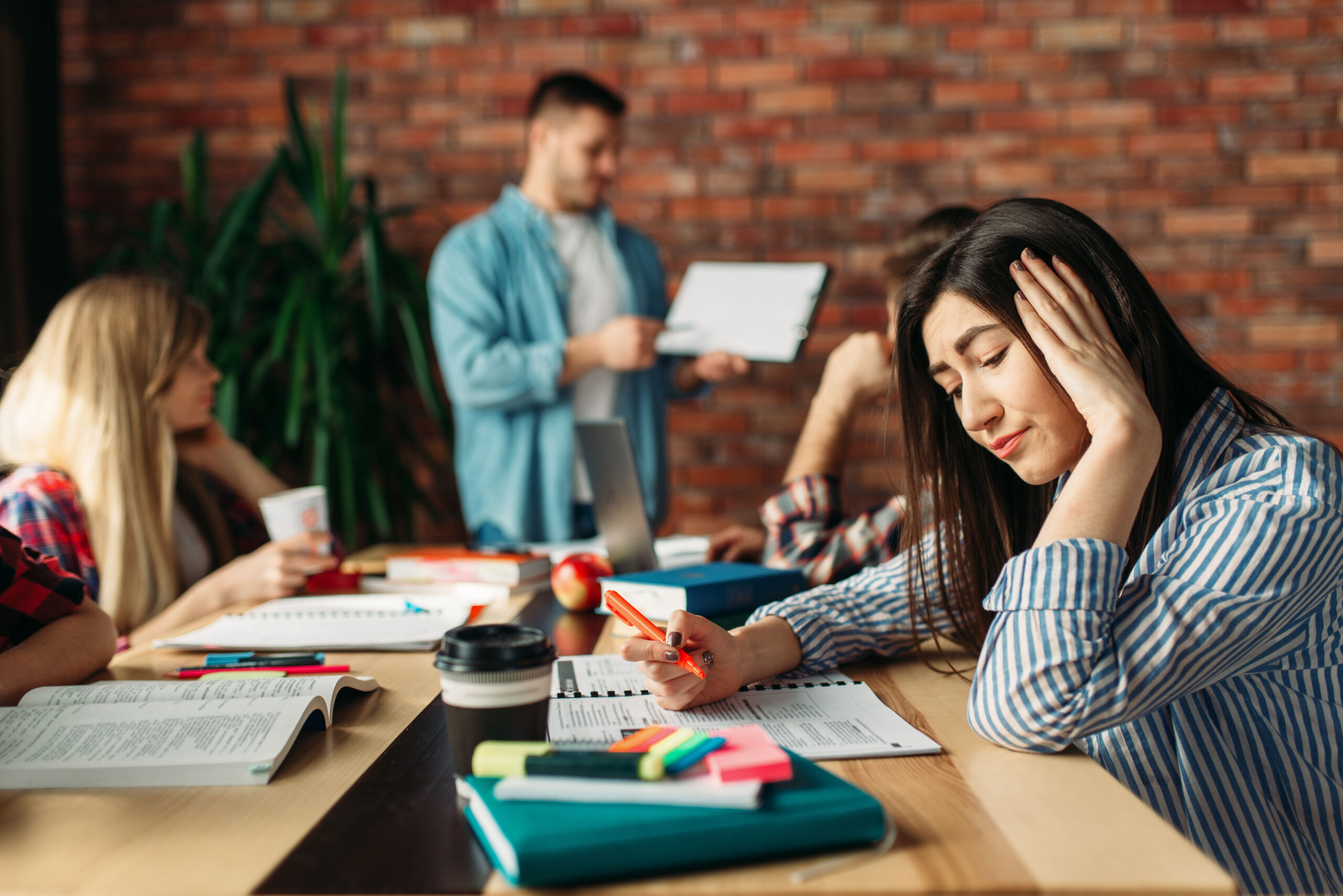 Young asian students campus helps friend catching up and learnin